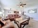 Living room with open concept to kitchen and dining area at 1526 White Hawk Way, Groveland, FL 34736