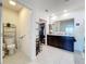 Main bathroom with double vanity and walk-in closet at 1526 White Hawk Way, Groveland, FL 34736