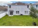Aerial view of house with solar panels and a large backyard at 1526 White Hawk Way, Groveland, FL 34736