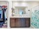 Bathroom with double vanity and shower at 1526 White Hawk Way, Groveland, FL 34736