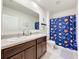 Bathroom with double vanity and shower/tub combo at 1526 White Hawk Way, Groveland, FL 34736