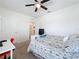 Bedroom with built-in shelving and workspace at 1526 White Hawk Way, Groveland, FL 34736
