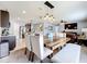Open concept kitchen with dark cabinets and a large island at 1526 White Hawk Way, Groveland, FL 34736