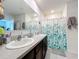 Bathroom with double vanity and shower/tub combo at 1526 White Hawk Way, Groveland, FL 34736