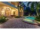Stunning pool and spa with a spacious patio and outdoor kitchen at 9164 Point Cypress Dr, Orlando, FL 32836