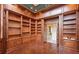 Library with hardwood floors and custom built-ins at 9164 Point Cypress Dr, Orlando, FL 32836