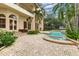 Relaxing pool and spa area with lush landscaping at 9164 Point Cypress Dr, Orlando, FL 32836