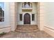 Elegant front entrance with ornate door and steps at 9164 Point Cypress Dr, Orlando, FL 32836