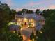 Luxury Mediterranean home with a large driveway and beautiful landscaping at 9164 Point Cypress Dr, Orlando, FL 32836