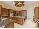 Gourmet kitchen with large island and granite counters at 9164 Point Cypress Dr, Orlando, FL 32836