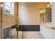 Bathroom with a shower/tub combo and updated vanity at 9164 Point Cypress Dr, Orlando, FL 32836