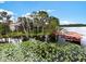 Lakefront property with lush landscaping and private dock at 9164 Point Cypress Dr, Orlando, FL 32836