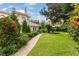 Landscaped walkway leading through lush gardens at 9164 Point Cypress Dr, Orlando, FL 32836
