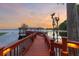 Long wooden dock extending to a lakefront boathouse at 9164 Point Cypress Dr, Orlando, FL 32836