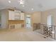 Bright bonus room with built-in shelving and a view to a sitting area at 9164 Point Cypress Dr, Orlando, FL 32836