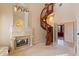 Sitting room with fireplace and spiral staircase at 9164 Point Cypress Dr, Orlando, FL 32836