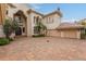 Brick driveway leading to a large home entrance at 9164 Point Cypress Dr, Orlando, FL 32836