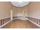 Large bedroom with wood flooring and access to other rooms at 9164 Point Cypress Dr, Orlando, FL 32836