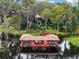 Private covered boat dock with seating area on the lake at 9164 Point Cypress Dr, Orlando, FL 32836