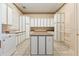Large laundry room with ample counter space and cabinets at 9164 Point Cypress Dr, Orlando, FL 32836
