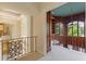 Upper level hallway with views into library and other rooms at 9164 Point Cypress Dr, Orlando, FL 32836