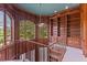 Upper level library with wood paneling and arched windows at 9164 Point Cypress Dr, Orlando, FL 32836