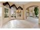 Bright breakfast room with water views and a chandelier at 9164 Point Cypress Dr, Orlando, FL 32836