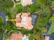 Bird's eye view of home, pool, and waterfront lot at 9164 Point Cypress Dr, Orlando, FL 32836