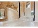 Two-story living room with curved staircase at 9164 Point Cypress Dr, Orlando, FL 32836