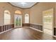 Bedroom with wood flooring and access to a bathroom at 9164 Point Cypress Dr, Orlando, FL 32836