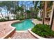 Resort-style pool with spa and screened enclosure at 9164 Point Cypress Dr, Orlando, FL 32836