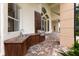Outdoor kitchen with built-in grill and sink at 9164 Point Cypress Dr, Orlando, FL 32836