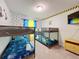 bedroom with two sets of bunk beds and Minions theme at 3397 Lilac Way, Davenport, FL 33897