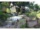 Landscaped community area with a pond and fountain at 8 Escondido Cir # 79, Altamonte Springs, FL 32701
