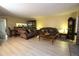 Bright living room with hardwood floors, fireplace and view into dining area at 8 Escondido Cir # 79, Altamonte Springs, FL 32701