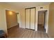 Bright hallway with hardwood floors and access to bedrooms at 8 Escondido Cir # 79, Altamonte Springs, FL 32701