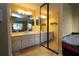 Double vanity bathroom with a mirrored closet at 8 Escondido Cir # 79, Altamonte Springs, FL 32701