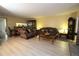 Bright living room with hardwood floors, fireplace and view into dining area at 8 Escondido Cir # 79, Altamonte Springs, FL 32701