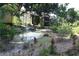 Landscaped community area with a pond and fountain at 8 Escondido Cir # 79, Altamonte Springs, FL 32701