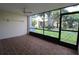 Spacious screened porch with tiled flooring and ceiling fan at 8 Escondido Cir # 79, Altamonte Springs, FL 32701