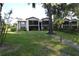 Condo building with walkway and landscaping at 8 Escondido Cir # 79, Altamonte Springs, FL 32701