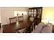 Formal dining area with dark wood table and chairs at 8 Escondido Cir # 79, Altamonte Springs, FL 32701