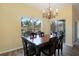 Dining room with wood floors and views to the patio at 217 Anastasia Dr, Kissimmee, FL 34759