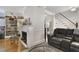 Living room with hardwood floors, fireplace, and built-in shelving at 1020 Wisconsin Ave, St Cloud, FL 34769