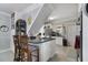 Kitchen with white cabinets, a breakfast bar, and stainless steel appliances at 1020 Wisconsin Ave, St Cloud, FL 34769