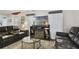 Relaxing living room with leather couches and a glass coffee table at 1020 Wisconsin Ave, St Cloud, FL 34769