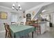 Bright dining room with a view into the kitchen at 1020 Wisconsin Ave, St Cloud, FL 34769