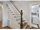 Classic staircase with white risers and dark wood handrail at 1020 Wisconsin Ave, St Cloud, FL 34769