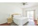 Bright bedroom with king-size bed, and sliding door to balcony at 9055 Treasure Trove Ln # 206, Kissimmee, FL 34747