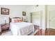 Cozy bedroom with a queen-size bed and walk-in closet at 9055 Treasure Trove Ln # 206, Kissimmee, FL 34747